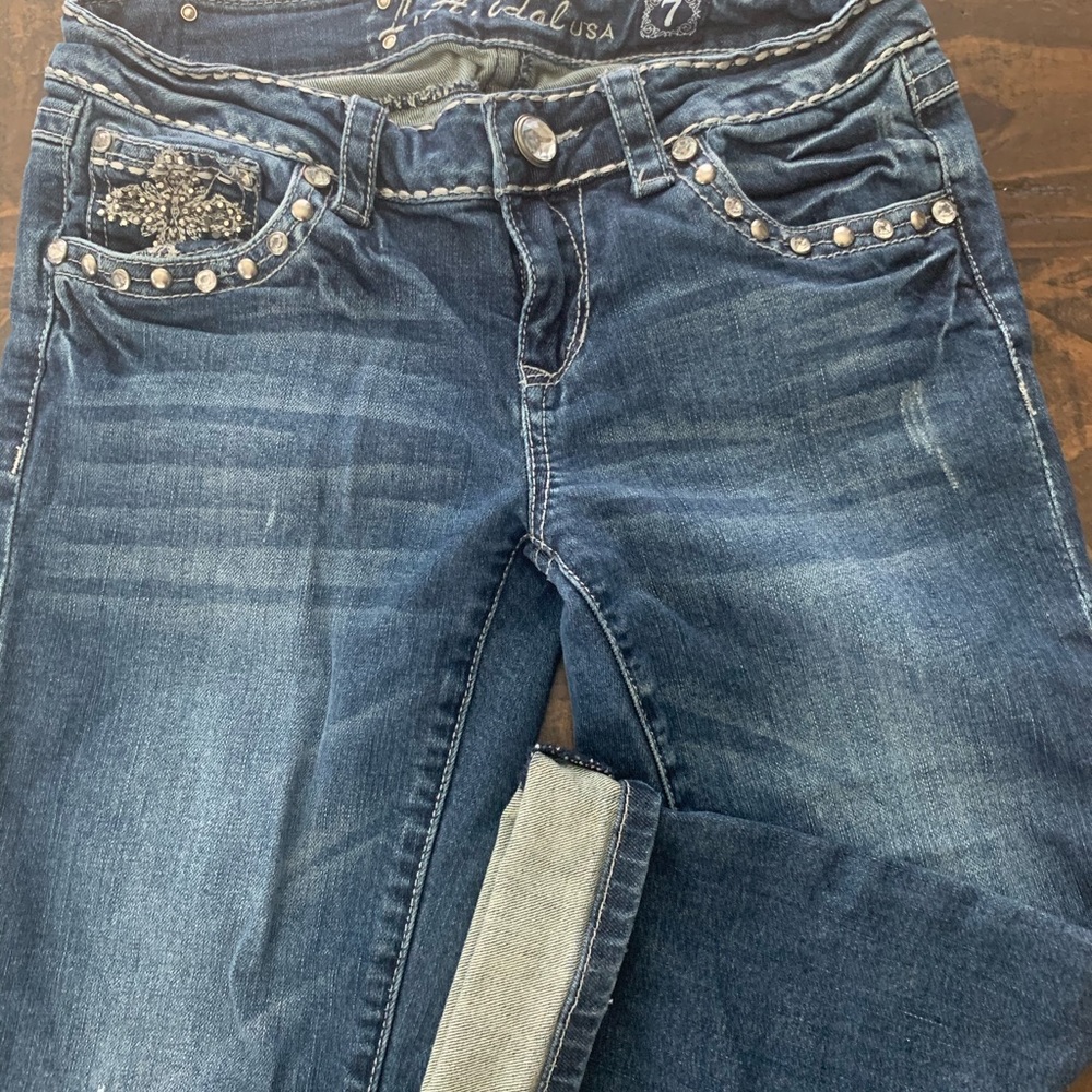 Cute denim capris with rhinestone and studs.